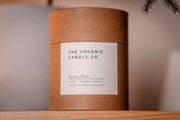 Organic candle in a natural paper brown container with &