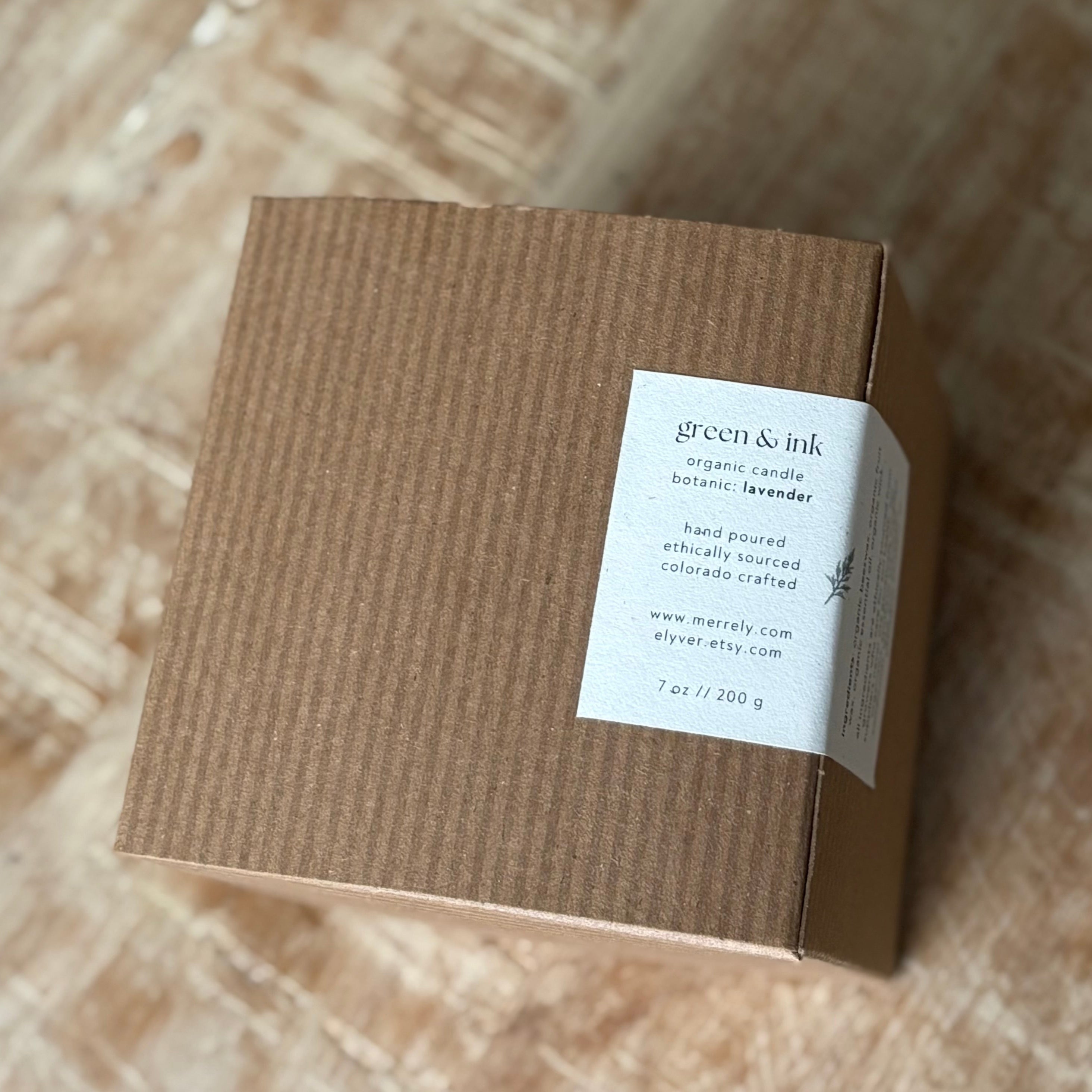 Brown cardboard box with a label on a wooden surface