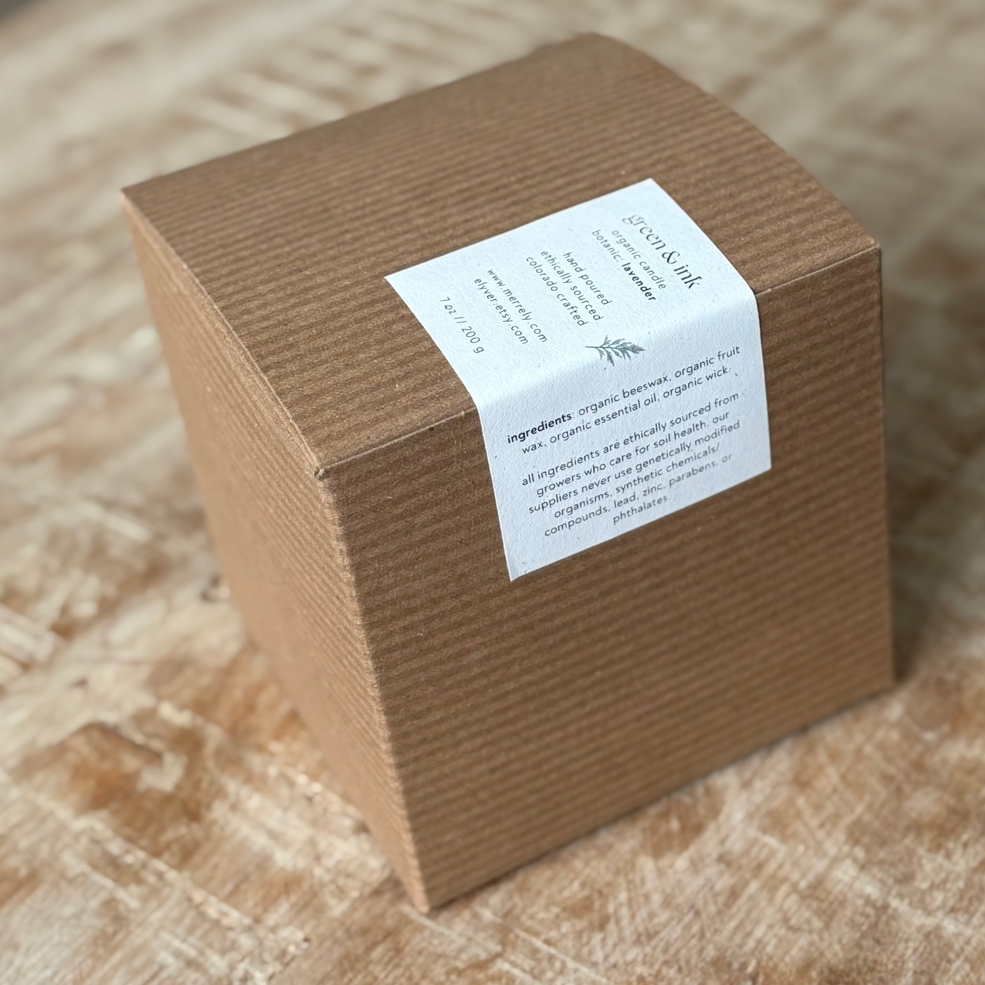 Brown cardboard box with a white label on a wooden surface