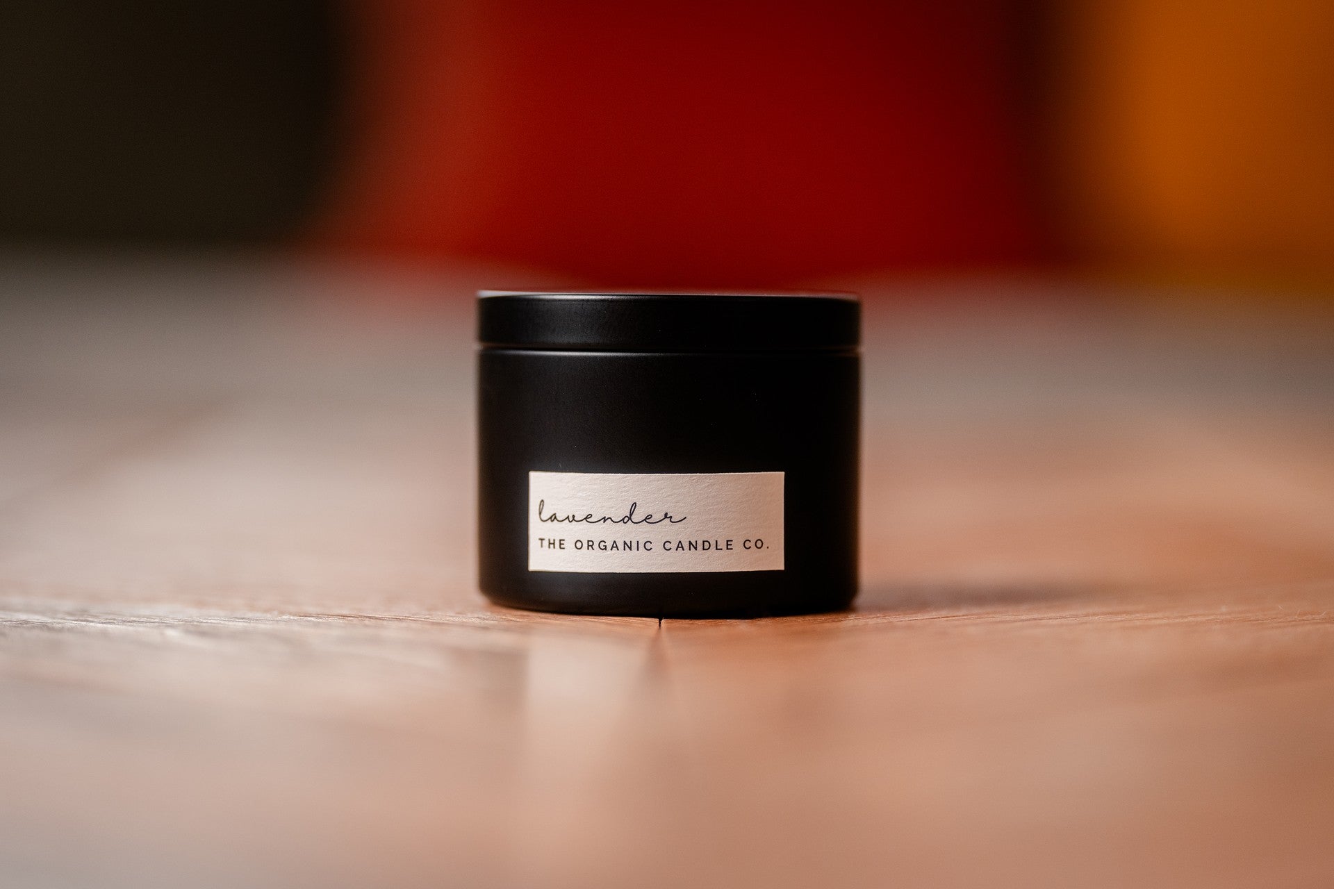 Organic candle in a black metal container candle container with &